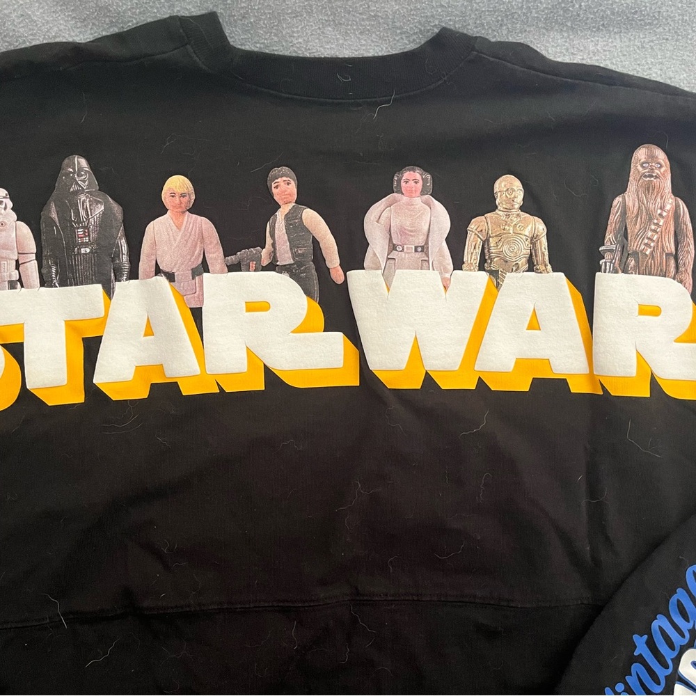 Star Wars 45 Year Anniversary Spirit Jersey with Yellow Logo and Characters